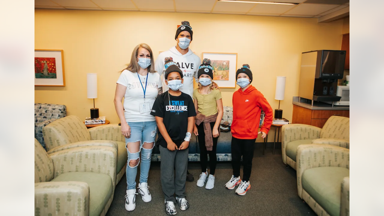 Greg Olsen distributes beanies at Atrium Health Levine Children’s Hospital